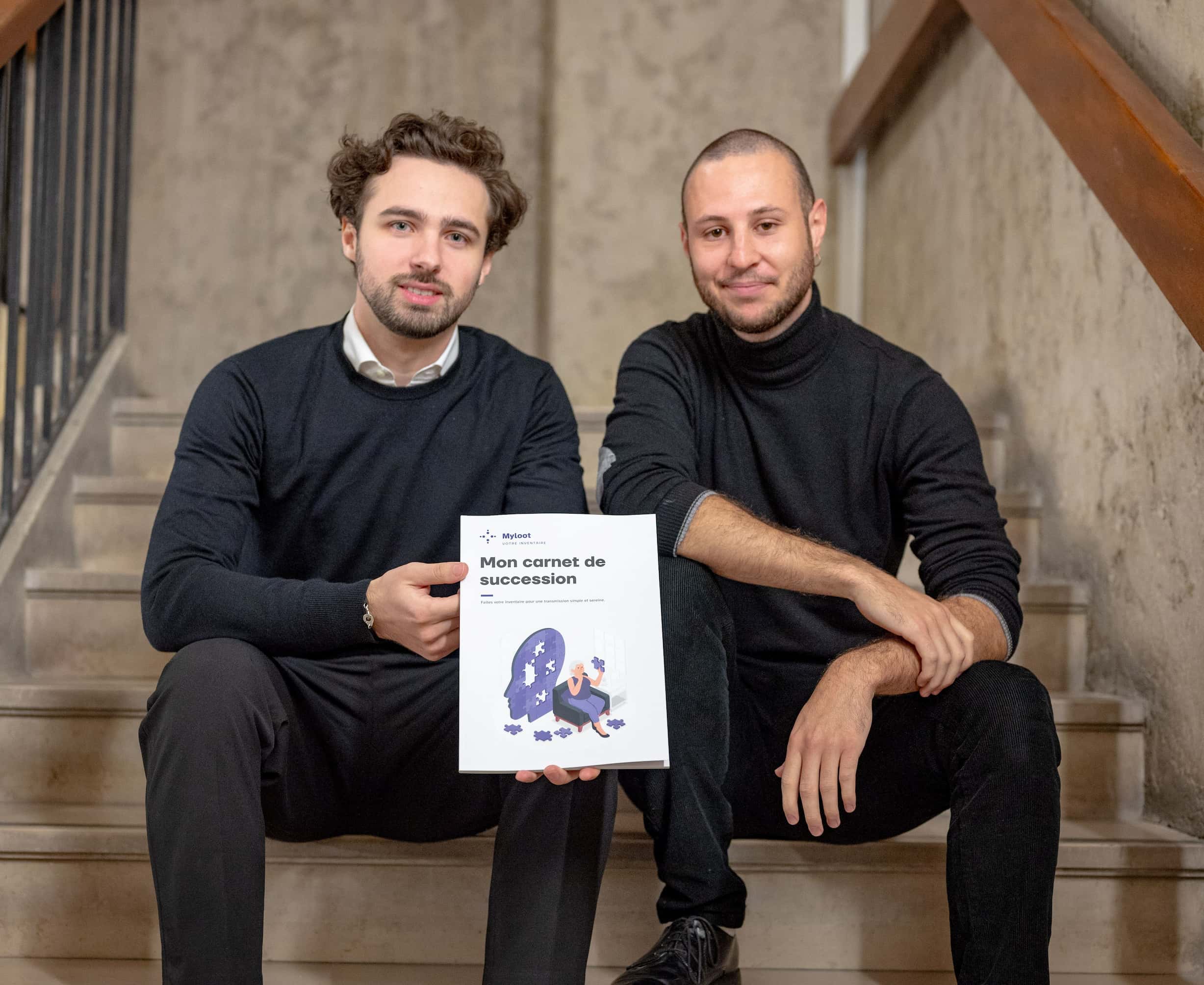 Arthur and Robin, co-founders of The Legacy Book Co., holding The Legacy Book